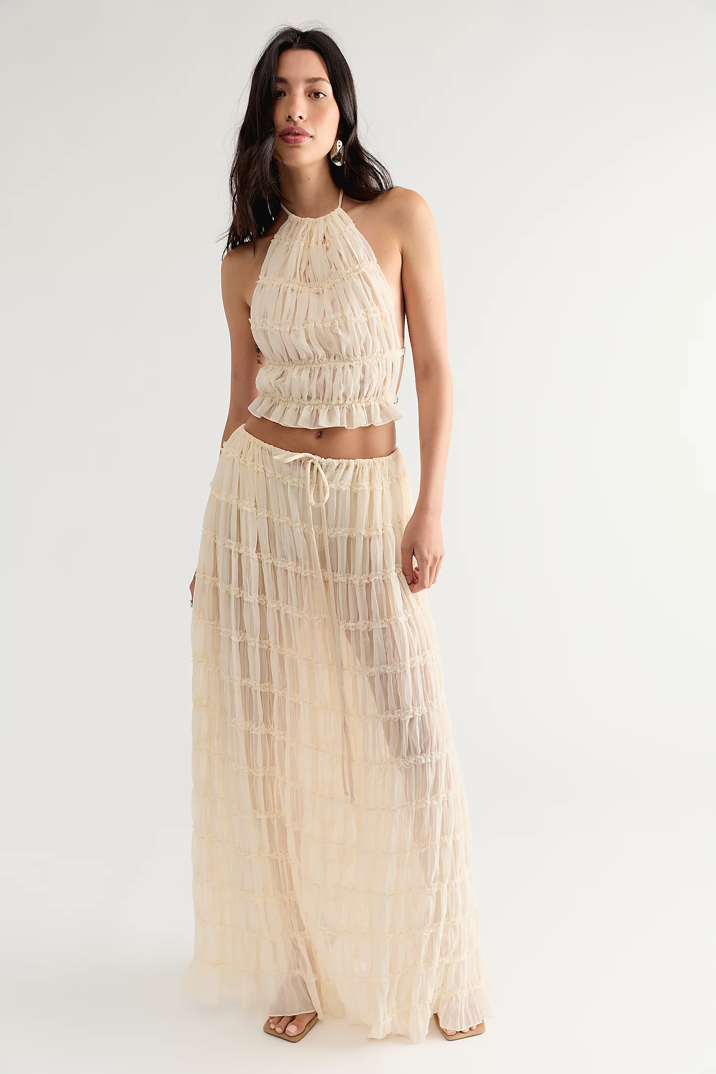Model wearing the Arcina Ori Juliette Maxi Skirt Set in cream